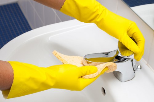 Cleaners sanitising shared office surfaces in Twickenham